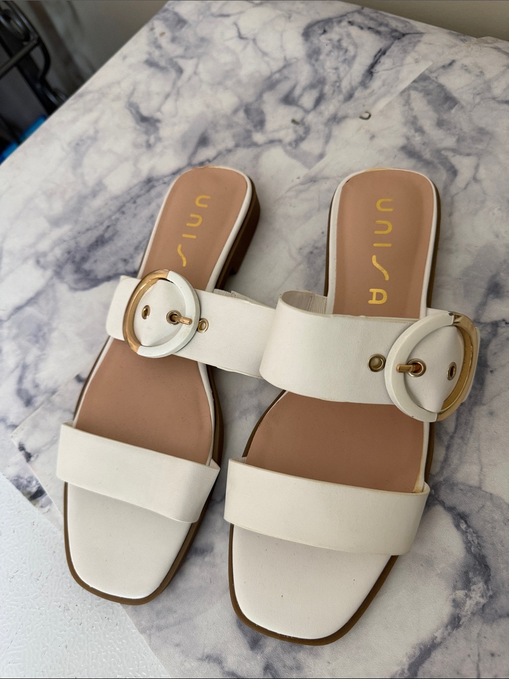 Unisa White Slide Sandals with Gold Buckle Accent